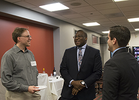alumni Scott Molski, Sam Mukiibi and Ernie Holtzheimer at 10th anniversary pro bono reception 2016